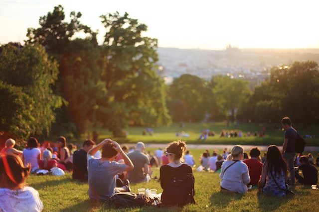 People sitting on the grass.